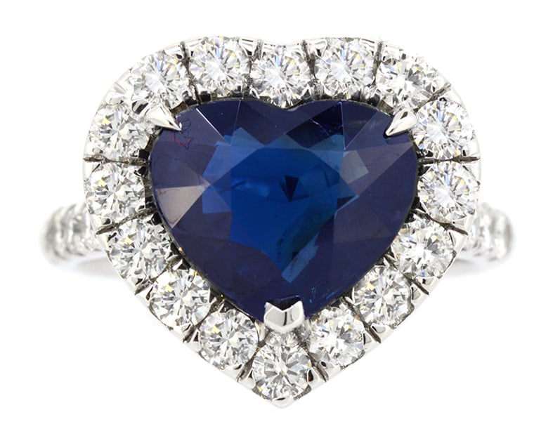 18K White Gold Ladies Ring with 5.29ct GIA Certified Heart Shapped Sapphire and 1.26ct tw Adjacent: Retail: $45,000.00 ****** 18K White Gold Ladies Ring with 5.29ct GIA Certified Heart Shapped Sapphire and 1.26ct tw Adjacent Diamonds ****** Size: 6.5 / Metal: 18K White Gold / Total Item Weight: 7.4 