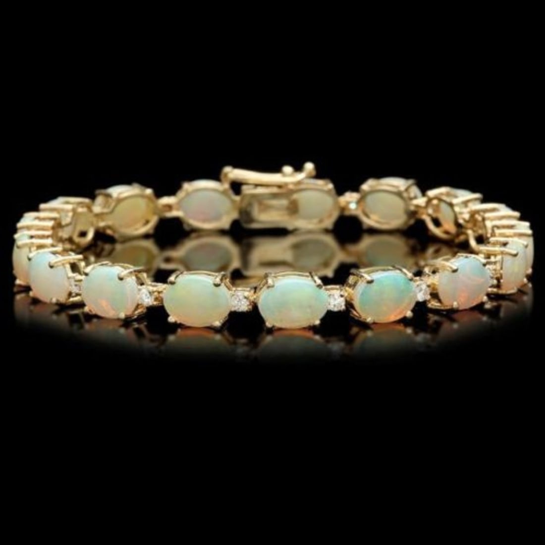 14k Gold 15.13ct Opal 0.79ct Diamond Bracelet: Retail: $21,500.00 ****** 14k Gold 15.13ct Opal 0.79ct Diamond Bracelet ****** Size: 7 / Metal: 14k Solid Yellow Gold / Total Item Weight: 12.0 grams / Country Made: United States / / Main Stone: