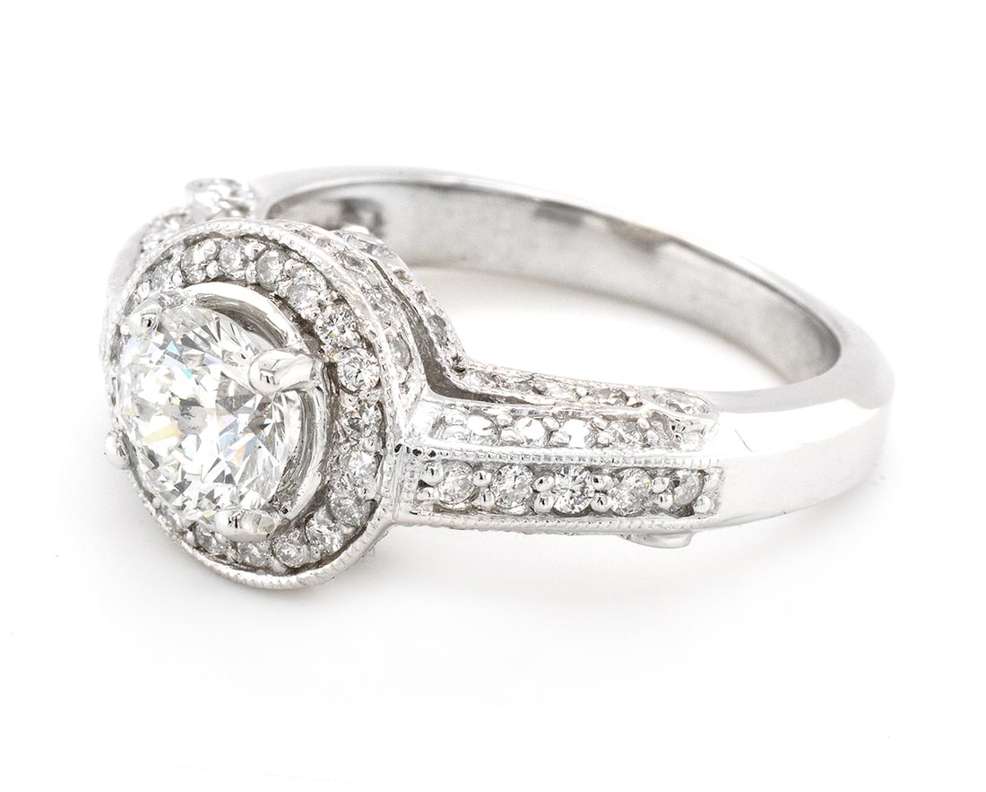 18K White Gold Ladies Ring with 1.03ct Center Daimoand and 1.29ct tw Adjacent Diamonds: Retail: $19,000.00 ****** 18K White Gold Ladies Ring with 1.03ct Center Daimoand and 1.29ct tw Adjacent Diamonds ****** Size: 6.5 / Metal: 18K White Gold / Total Item Weight: 7 Grams / Country Made: U