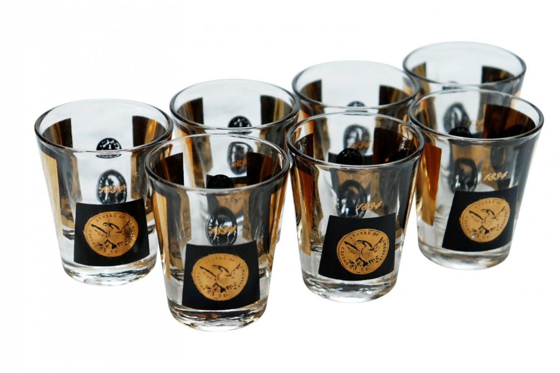 Mid century gold and black coins shot glass set of 7: Beautiful Mid century gold and black shot glasses with painted gold coins set of 7In very good condition.