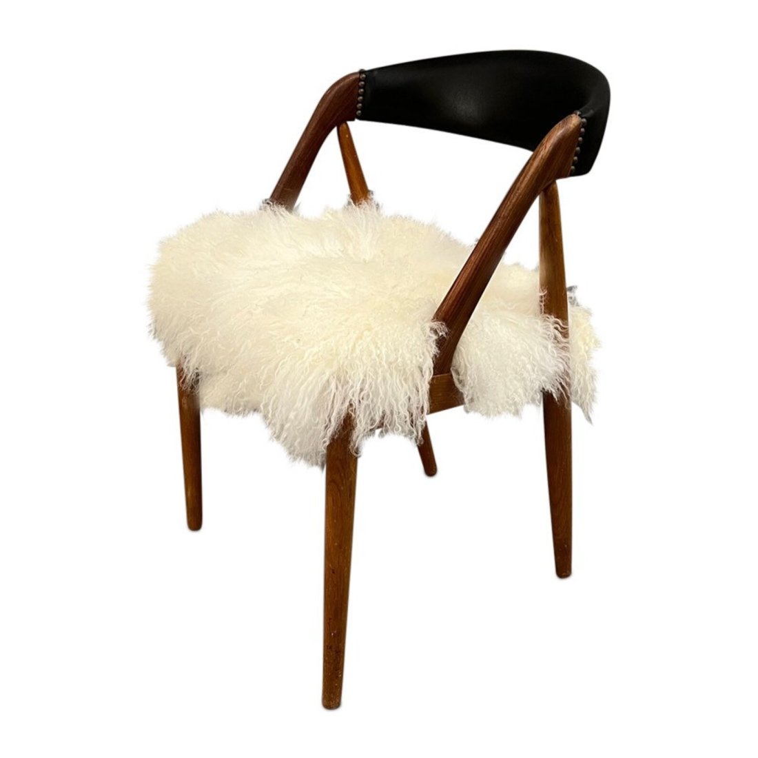Curated Mid Century dining/ office/accent chair with new Mongolian fur on the seat & black leather o: Curated Mid Century dining/ office/accent chair with new Mongolian fur on the seat & black leather on the back 1960â€™s CircaW21 x D18 x H29 inches Seat height: 18 inches