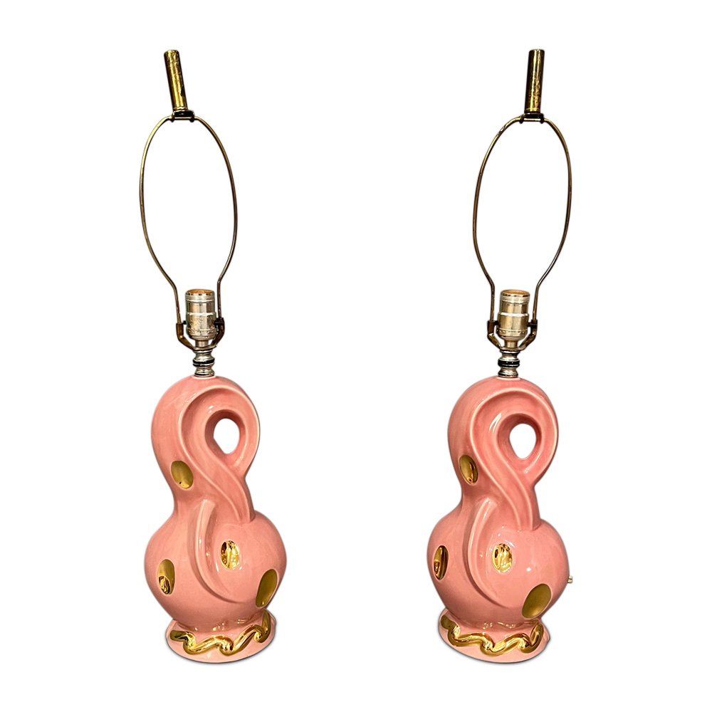 Hollywood Regency Porcelain Pink and Gold Table 1960s Circa: Hollywood Regency porcelain pink and gold table lamps tested and working 1960s CircaDimensions: Base: 5.5” diameter Total height: 27.5” inches with harps/Finials.