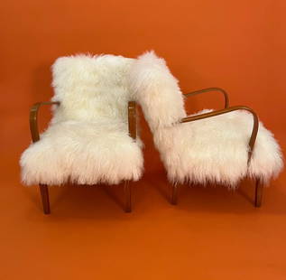 ART Deco Pair Swedish sculpture curved arms Lounge chairs 1930’s circa with new real Mongolian: ART Deco sculpture curved arms Lounge chairs 1930’s circa PAIRDimensions: Arm to arm: 25 inches Depth: 26 inches High back 32 inches Seat height: 16 inches Arms height: 25 inches