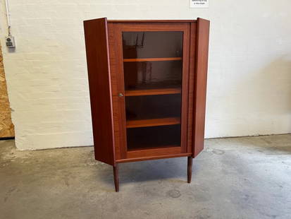 Mid-Century teak corner cabinet with Glass door: Mid-Century teak corner cabinet---Dimensions: Width: 35 in ---Depth ---22 in Front to back corner---Front dim. to back corner 25 on both sides