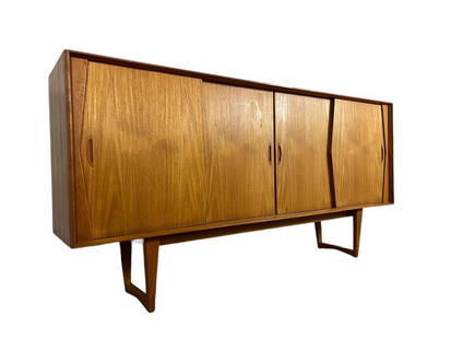 Mid-Century Danish Teak Sideboard with sliding doors and shelves: Dimensions: W 86" x D 18" x H 44 inches Mid-Century Danish Teak Sideboard with sliding doors and shelves