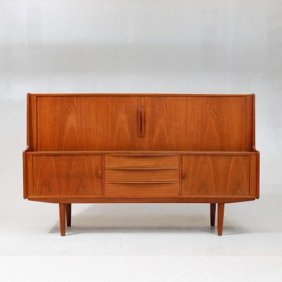 This Mid Century Danish Teak Sideboard, designed by Ib Kofod-Larsen for Faarup Møbelfabrik, is a