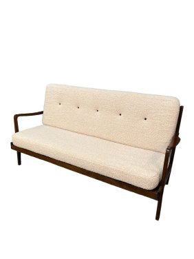 Indulge in the captivating allure of our meticulously curated Mid Century sofa, expertly handpicked