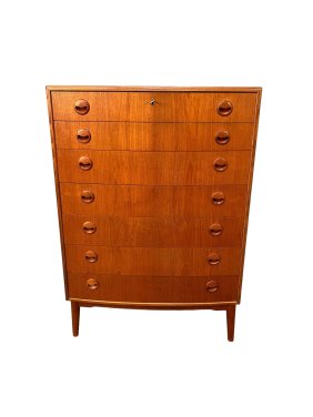 Enhance your living space with this stunning mid-century highboy teak dresser from Denmark.