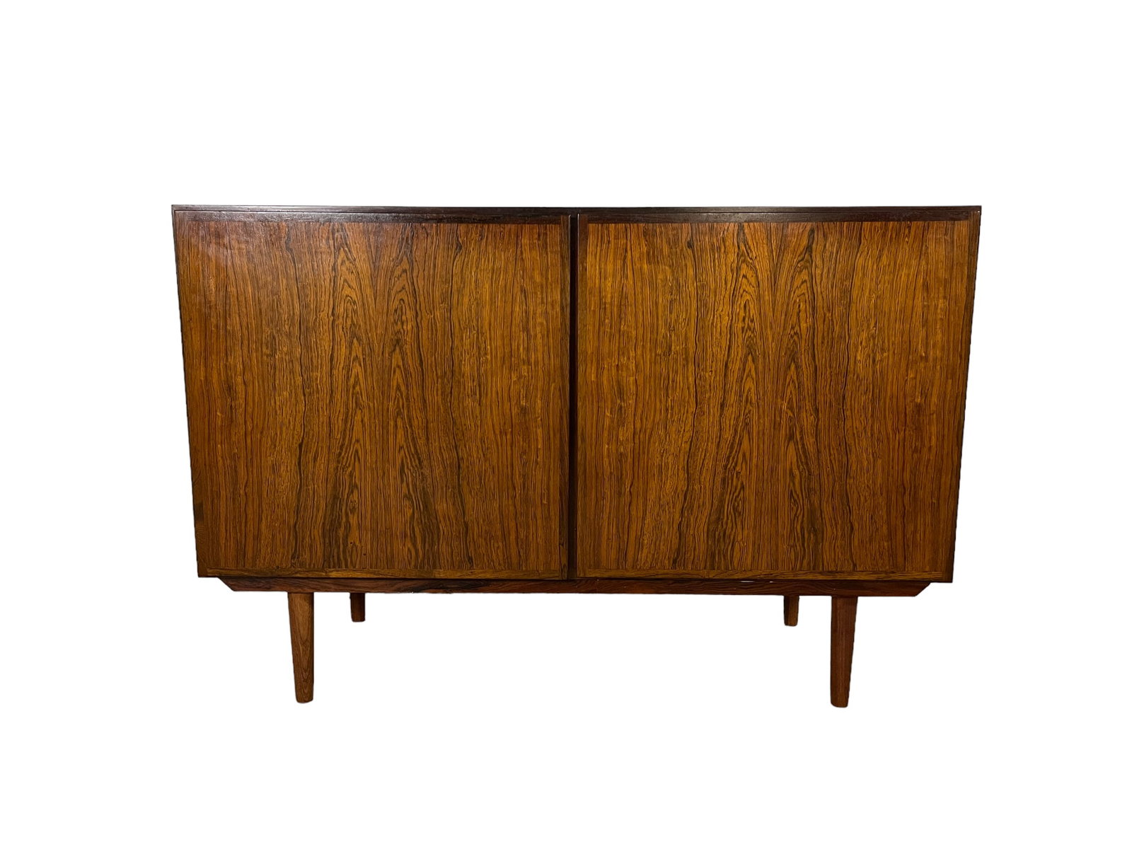 Mid-Century Modern Rosewood sideboard Oman 1960's: Dimension: W35 x D19 x H25 inches Mid-Century Modern Rosewood sideboard Oman 1960's with sliding doors and drawers Very good condition considering Age & Use Lot 14