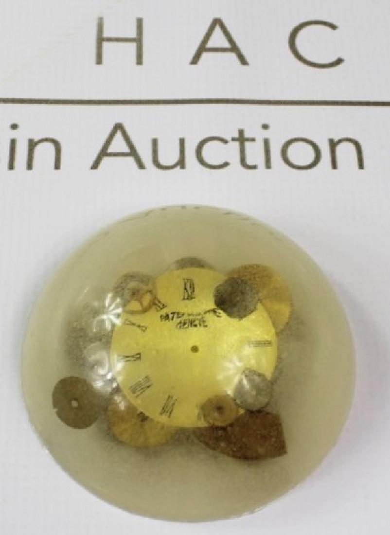 Patek Philippe Paperweight: A patek philippe paperweight. Dimensions: 4 x 2 inches.