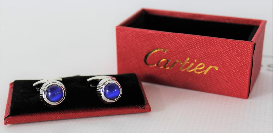 Cartier Cufflinks: Cartier blue stone silver watch crown cufflinks.