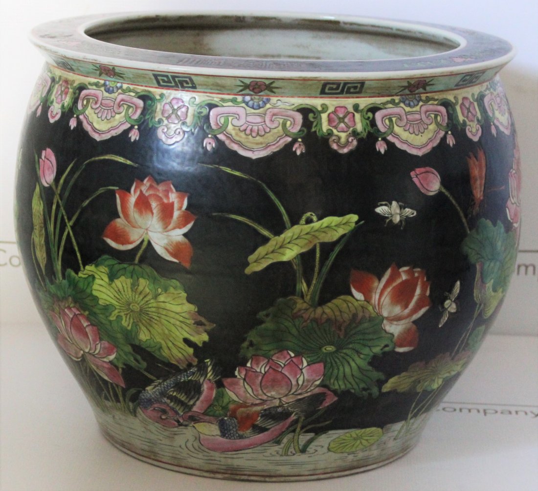 Chinese, Qing Dynasty Fish Bowl: China, Qing Dynasty era large fish bowl with a floral and fish design. Dimensions: 13.75 x 16.5 inches.