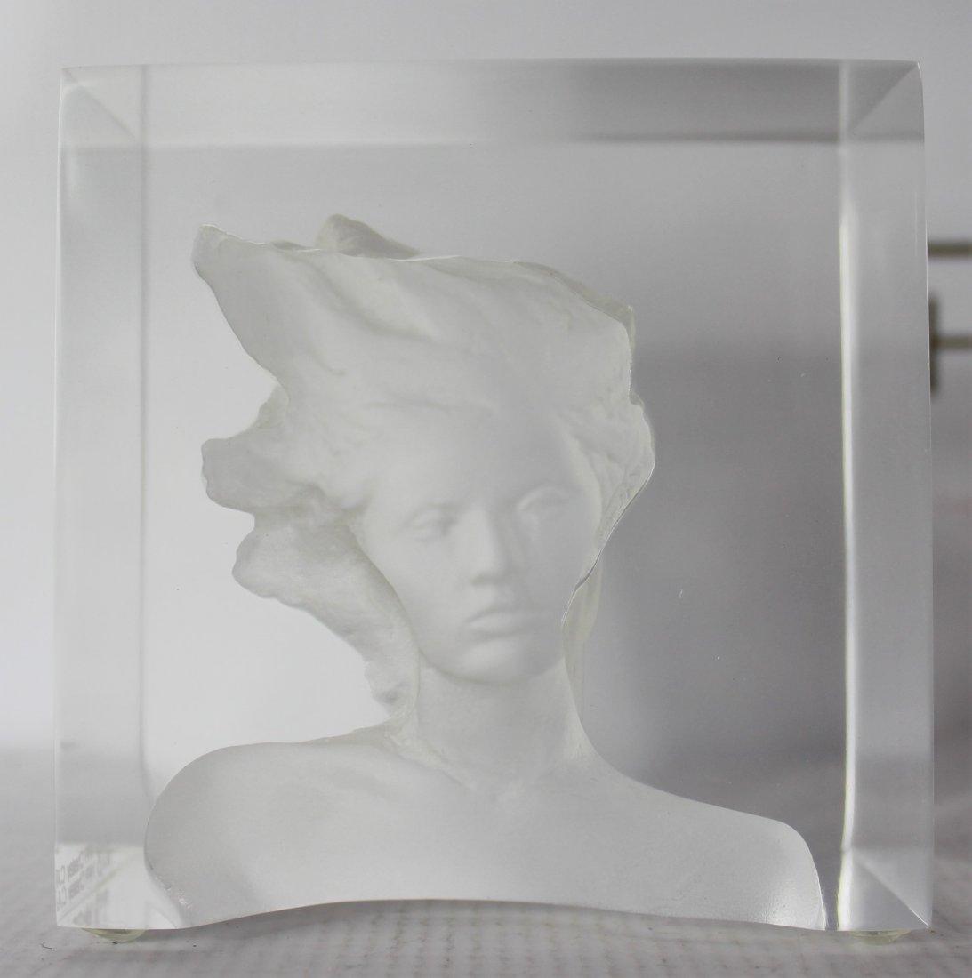 Frederick Hart (American, 1943-1999): Medium: Clear acrylic. Subject: Woman sculpture, 1999. Signature: Bottom. Dimensions: 4 x 4 x 2.5 inches.