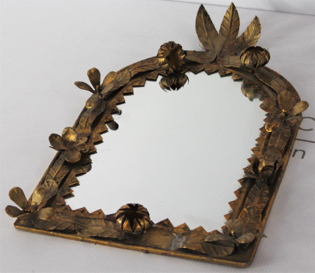 Antique Mirror: Antique metal mirror. Dimensions: 14 x 9 inches.