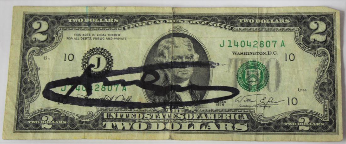 Andy Warhol (American, 1928-1987): Two dollar signed bill by Andy Warhol.