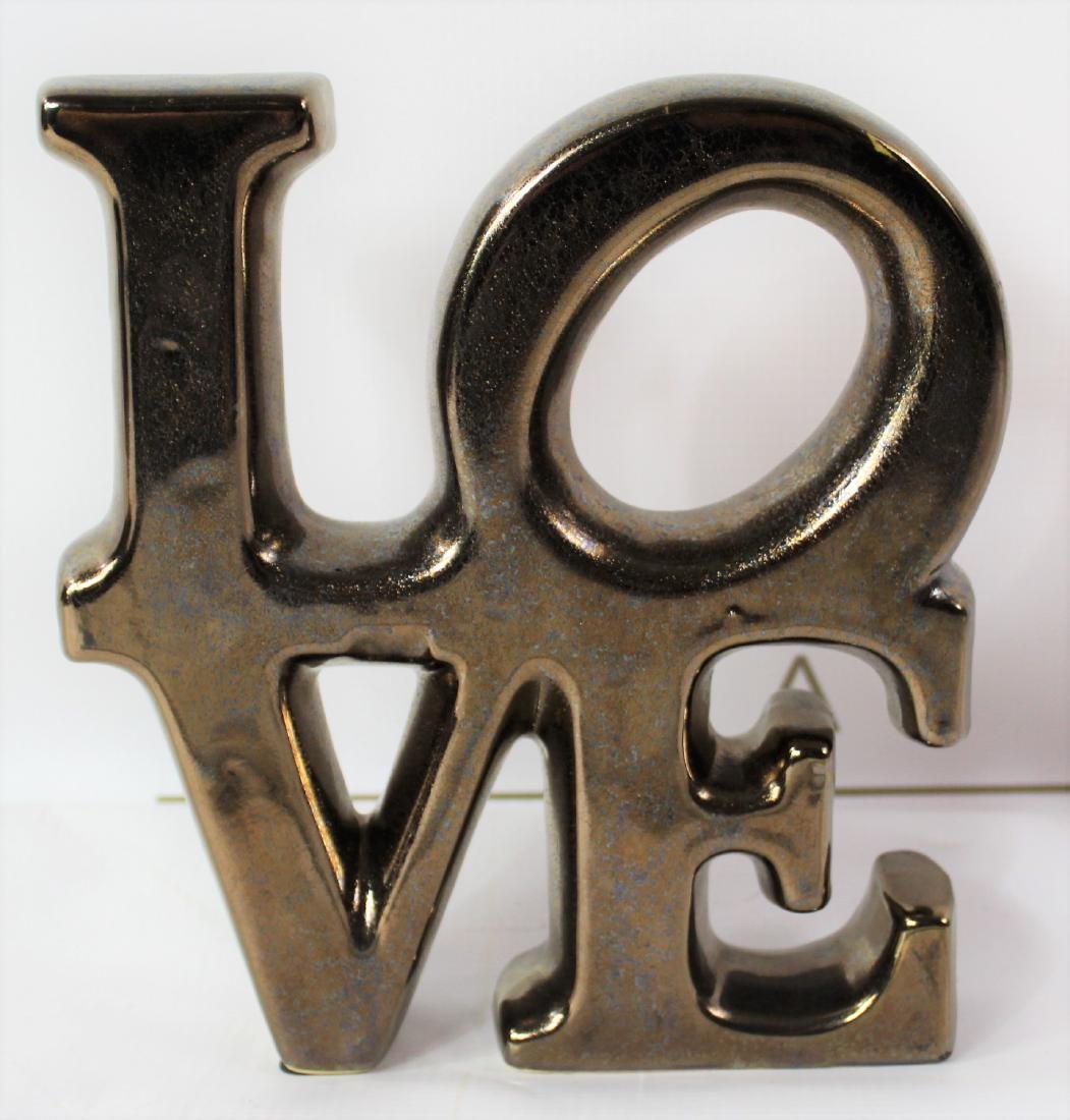 Robert Indiana LOVE Sculpture: Robert Indiana LOVE sculpture paperweight. Dimensions: 8 x 7 inches.