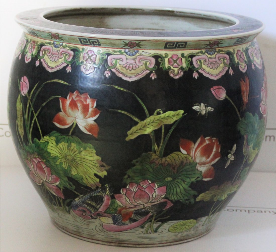 Chinese, Qing Dynasty Fish Bowl: China, Qing Dynasty era large fish bowl with a floral and fish design. Dimensions: 13.75 x 16.5 inches.