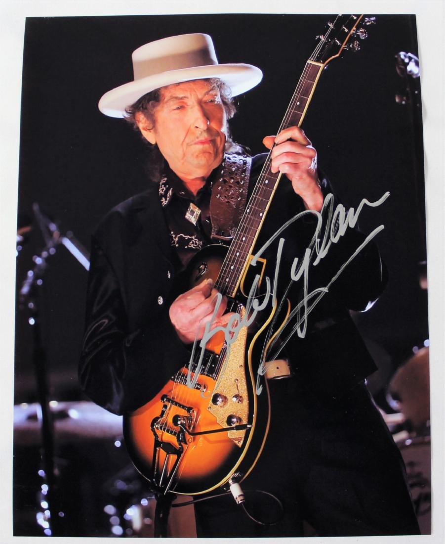 Bob Dylan Autographed Photo: Bob Dylan autographed photo. Dimensions: 8.5 x 11 inches. COA included.