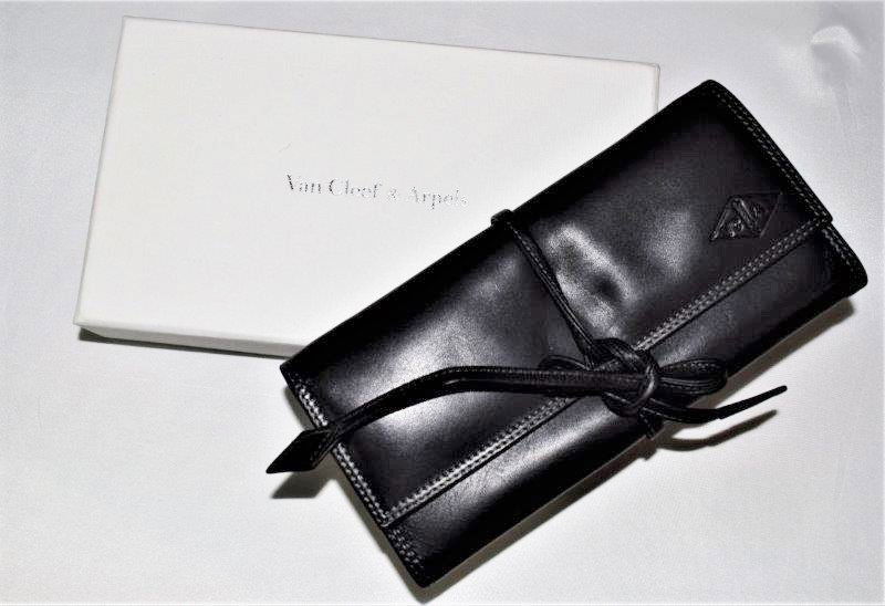 Van Cleef & Arpels Wallet: A black Van Cleef & Arpels wallet. Dimesnions: 7 X 4 inches