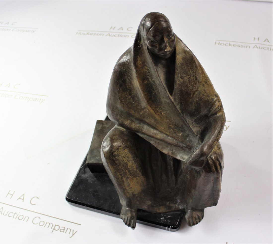 After Francisco Zuniga Costa Rican Bronze Sculpture: Medium: Bronze with greenish brownish patina (after Zuniga). Title: Seated Woman, 1975. Signature: Backside and dated. Dimensions: 14.5 x 13 x 13 inches. Lot note and provenance: Salvation Army, San F