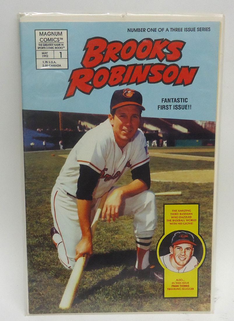 (4) PCS. BALTIMORE ORIOLES BASEBALL EPHEMERA: (1) 1954 Opening Year Official Souvenir Sketchbook - 50 cents; (1) The Home Team 1894-1970, $3.00; (1) 1969 World Series Souvenir Program, $1.00; (1) Brooks Robinson - Magnum Comic book, 1992, #1 of 3
