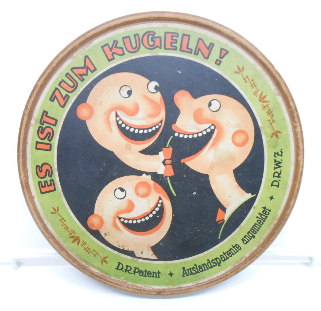 GERMAN MARBLE GAME - ES IST ZUM KUGELN: Box constructed of heavy duty cardboard with paper litho; wooden marbles and dice; included in original round box; charming graphics on box lid; instructions are adhered to underside of box top; botto