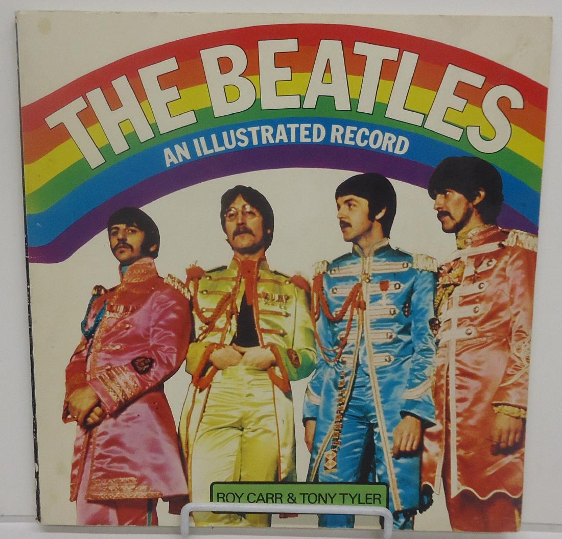 THE BEATLES - AN ILLUSTRATED RECORD BOOK: By Roy Carr and Tony Tyler; Harmony Books / Crown Publishers, 1975; soft cover; cover has some minor creases and spots; edges slightly rough; 11 1/2" x 11 1/2", G-VG