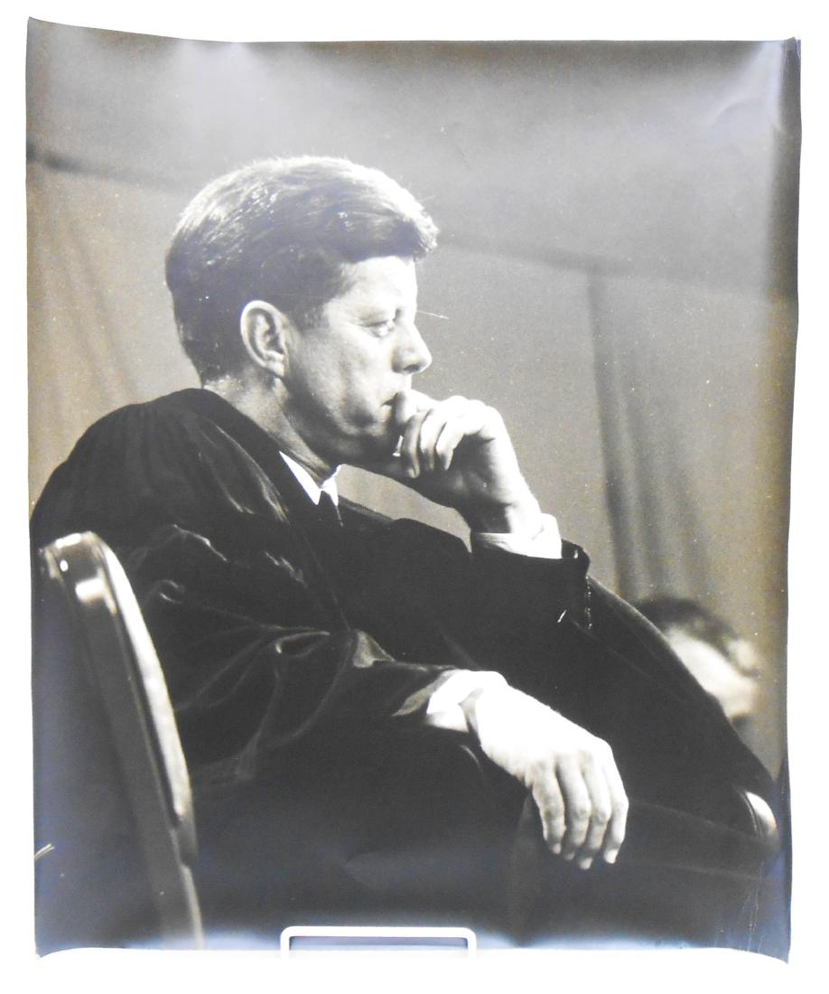 (4) PHOTOGRAPHS OF JOHN F KENNEDY BY EDWARD CLARK: Large folio style prints of the same image of Kennedy; Life photographer, Edward Clark, took many images of JFK and the First Family; images have curling and edge wear; unsigned; undated; there must h