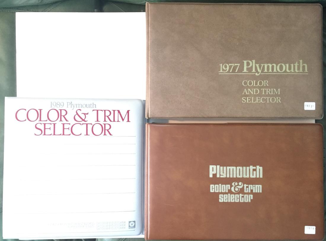 (3) PLYMOUTH DEALERSHIP COLOR & TRIM DATA BOOKS - MOPAR: Includes: (1) 1976; including: Volare, Valiant-Duster, Fury, Gran Fury, Voyager, Trail Duster; (1) 1977; including: Volare, Valiant-Duster, Fury, Gran Fury, Voyager, Trail Duster; (1) 1989; including: