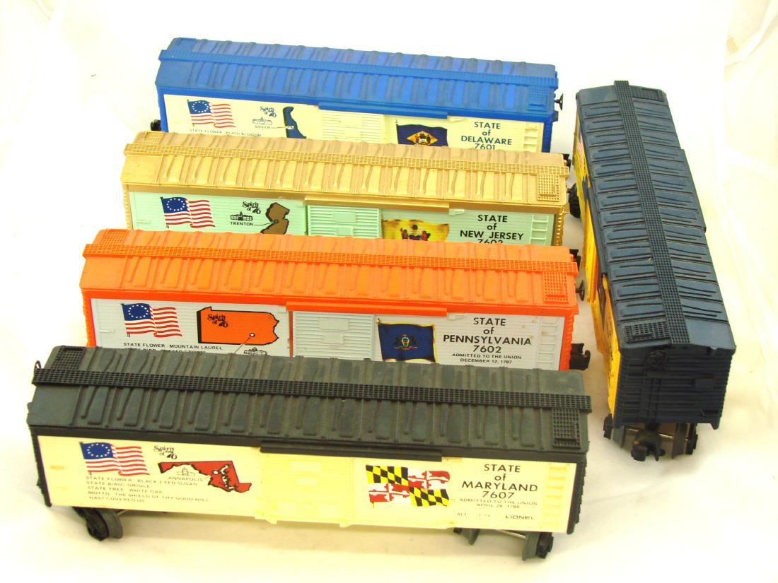 (6) LIONEL SPIRIT OF '76 BOX CARS: original boxes; (1) 7601 Delaware; (1) 7602 Pennsylvania; (1) 7603 New Jersey; (1) 7607 Maryland; (1) 7611 New York; box length L-13", EX-NM