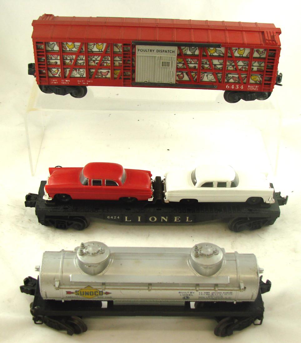(3) LIONEL CARS: (1) 2465 Sunoco tank car with original box; (1) 6434 poultry dispatch car; (1) 6424 twin auto flat car; L-12", VG-EX