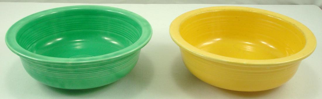(2) VINTAGE FIESTA 9 1/2 INCH NAPPY: Green and yellow nappie; both with impressed "HLC (monogram) Fiesta Made in USA", yellow has ink stamp as well; yellow bowl has moderate to heavy wear to interior and rim; G-EX