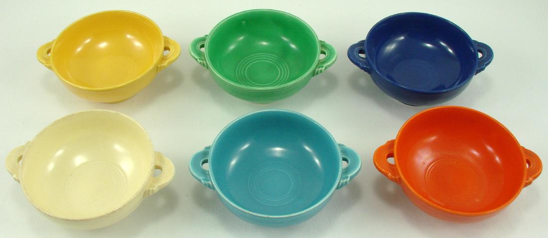 (6) VINTAGE FIESTA CREAM SOUP CUPS: In each of the original six colors: red, cobalt, green, yellow ivory and turquoise; impressed "Fiesta HLC USA" mark; normal wear, mostly visible on ivory bowl; L-6 5/8", VG-EX