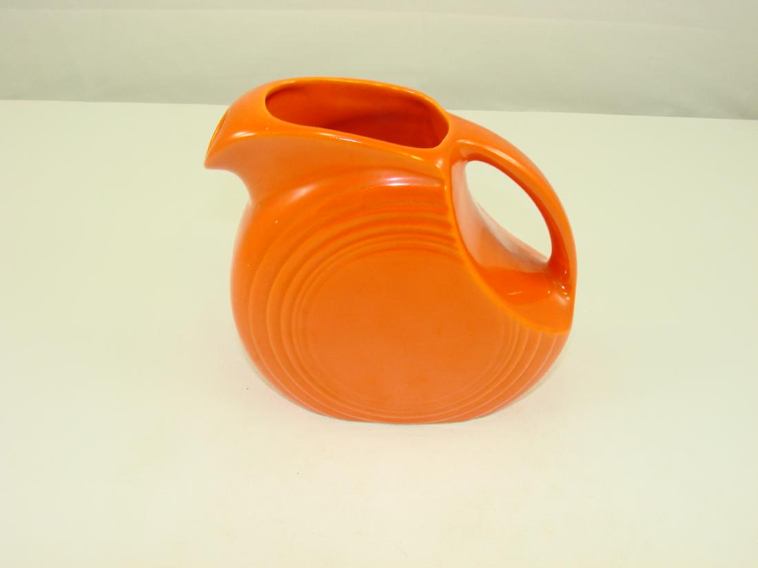 VINTAGE FIESTA JUICE PITCHER - RED: Impressed "HLC (monogram) Fiesta Made in USA", in concentric rings; H-5 15/18", L-6 1/2", EX-NM