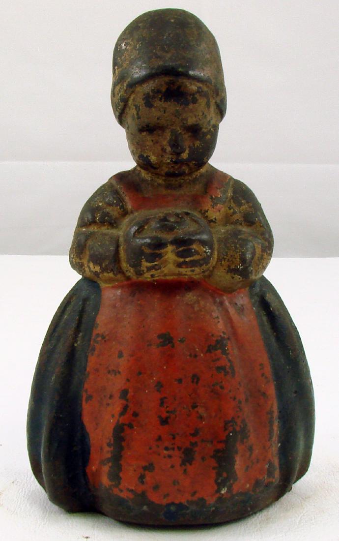 DUTCH GIRL DOORSTOP: Painted cast iron; overall paint losses; H-6 1/2" ,F-G