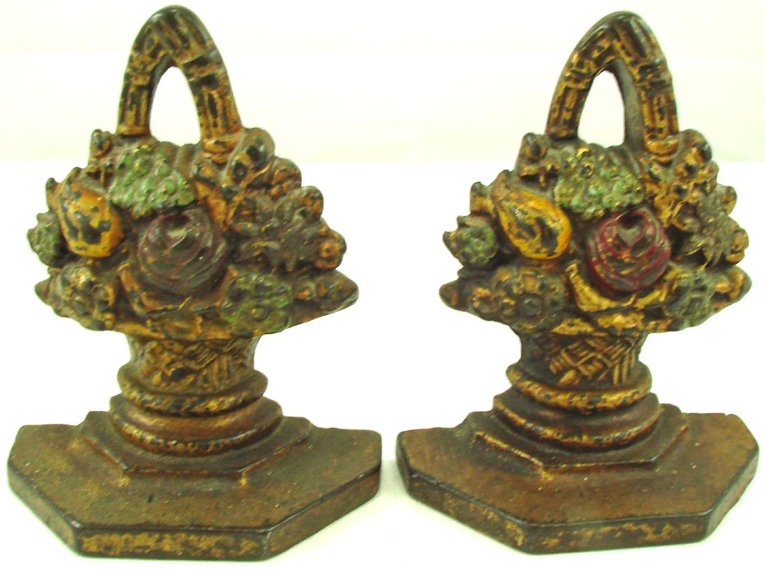 PAIR OF FLOWER BASKET BOOKENDS: Painted cast iron; each stamped 1002; original paint; moderate paint wear and chips; H-6 1/2", G-VG