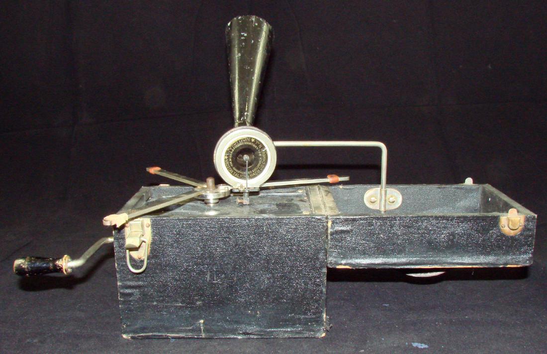 KAMERAPHONE PORTABLE PHONOGRAM: crank mechanism record player in a box the size of a Brownie camera; black leatherette covered case with leather handle; retains crank, collapsible turn table, tone arm, and reproducer; speaker (horn)