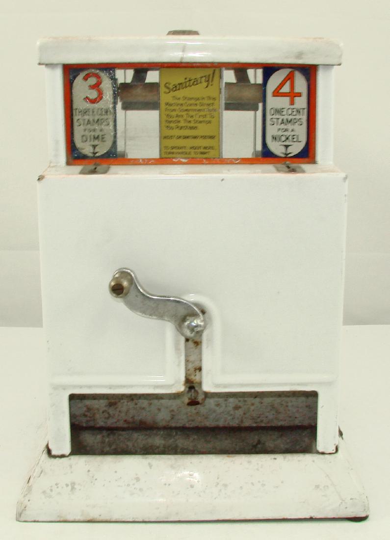 ART DECO "SANITARY" STAMP VENDOR: Enameled metal coin-op stamp vendor; vends 3 cent and 4 cent stamps; glass rear panel; no key; crank moves freely; Northwestern Corporation; some discoloration to enamel mainly to horizonal surfaces a