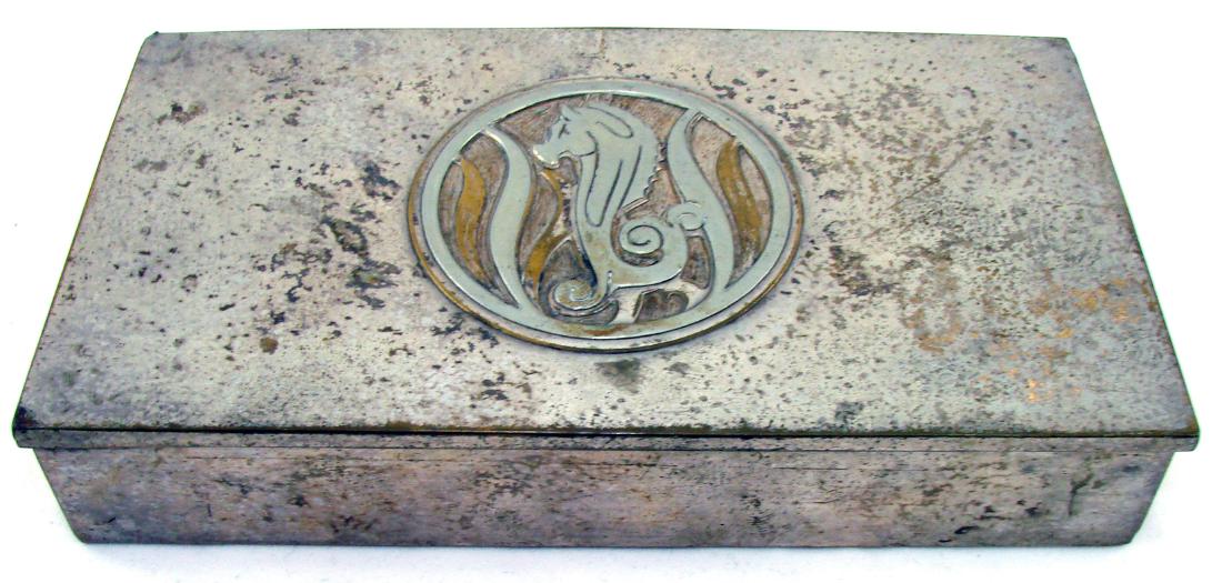 ART DECO SILVERCREST CIGARETTE BOX: Silverplate box with wooden lining; great central medallion with seahorse motif; marked "Genuine Silver Crest Bronze" stamped 506-c; some plating loss and wear; L-6 5/8", G+