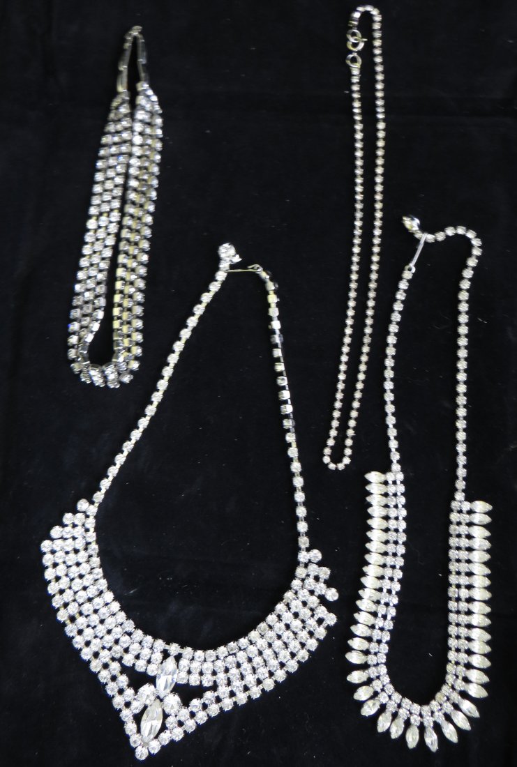 (4) VINTAGE ART DECO RHINESTONE NECKLACES: Includes: (1) rhinestone choker with three rows of stones, some finish loss to back and clasp; L-12 1/2"; (1) rhinestone necklace, L-15"; (1) single strand, L-15"; (1) Weiss three strand choker, L-15 
