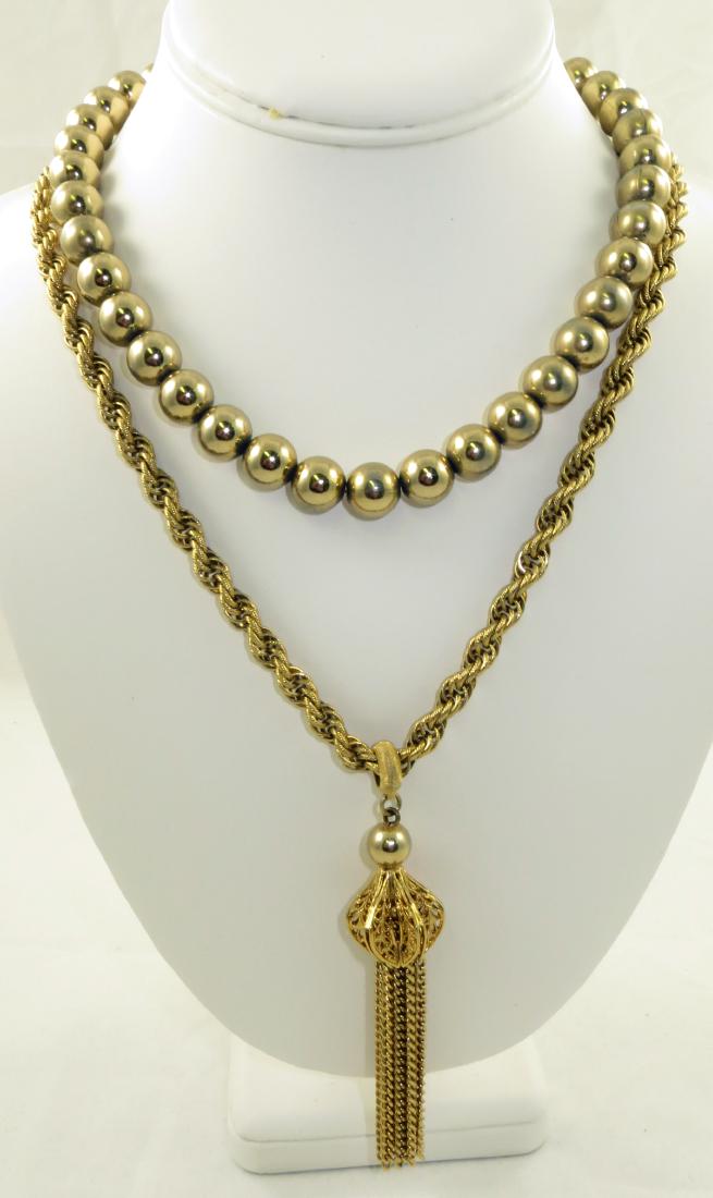 (2) VINTAGE MONET GOLDTONE NECKLACES: Includes: (1) necklace, twsited rope style chain with filigree tassel style pendant, pendant L-4 1/8"; necklace L-24"; (1) vintage goldtone bead style choker, tagged Monet,hook style closure, L-17 1/2