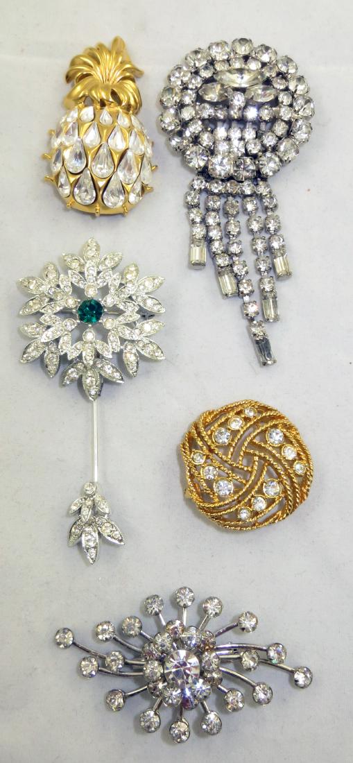 (5) RHINESTONE BROOCHES: Includes: (1) floral form pin: stick pin base, pinback, with pendant bail; clear rhinestones with green central stone; L-3 1/2"; (1) brooch, silvertone, L-2 5/8"; (1) round goldtone brooch, set with c