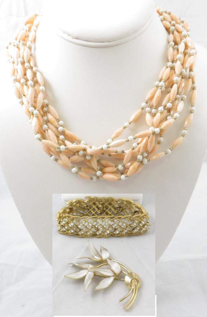 (3) PIECES SIGNED COSTUME JEWELRY: TRIFARI & CORO: Includes: (1) goldtone Coro brooch, branch motif with silver enamel, L-2 3/4"; (1) Trifari bracelet, goldtone with clear rhinestones, basketweave design; missing two rhinestones; L-7"; (1) Trifari mul