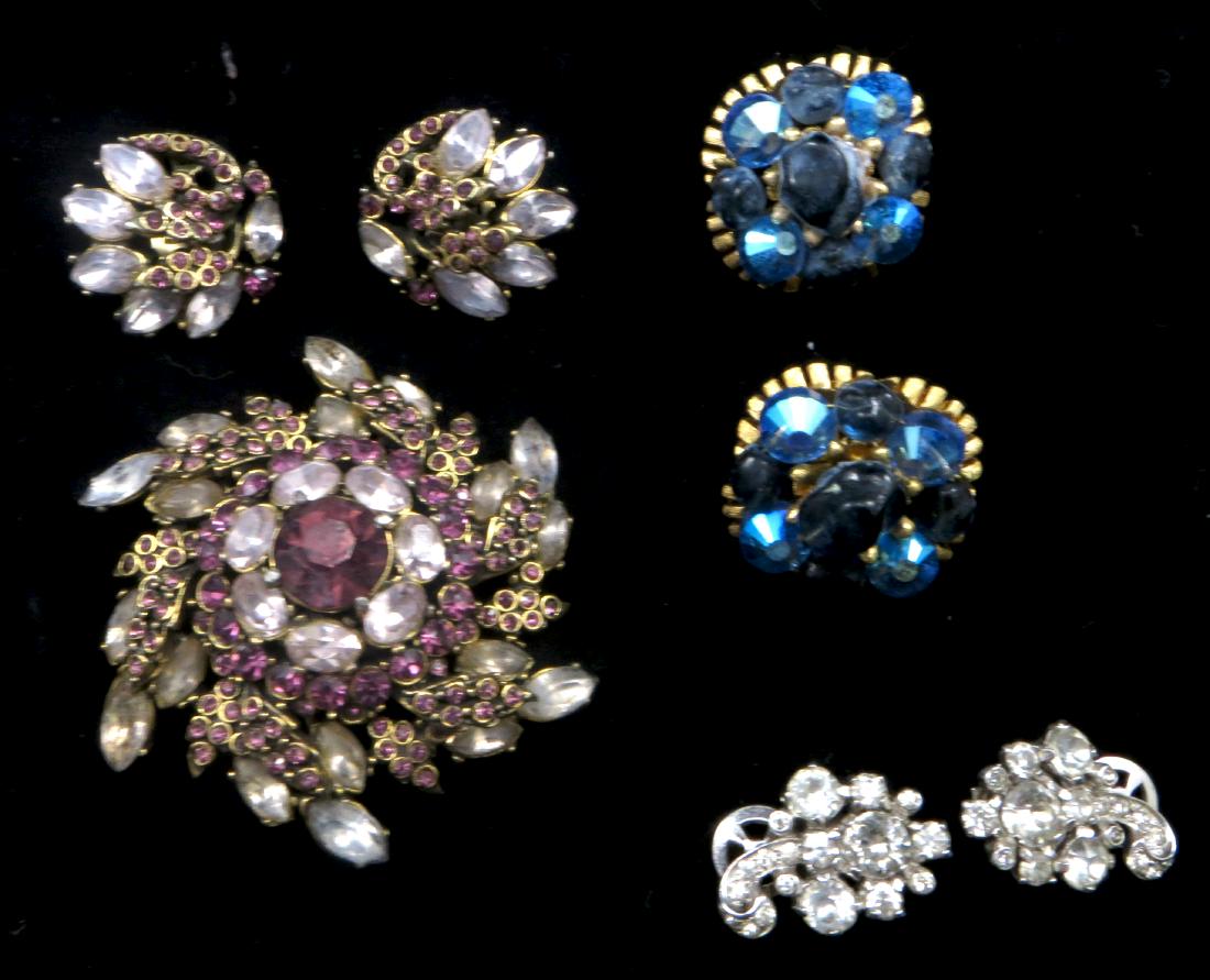 (4) PIECES HOLLYCRAFT, TRIFARI & MAZER RHINESTONE: (1) 1952 Hollycraft lavender & purple brooch, (1) pair matching earrings; (1) pair Trifari blue and black clip earrings; (1) Mazer white studded clip earrings; normal ear; longest L-2 1/2", VG-EX
