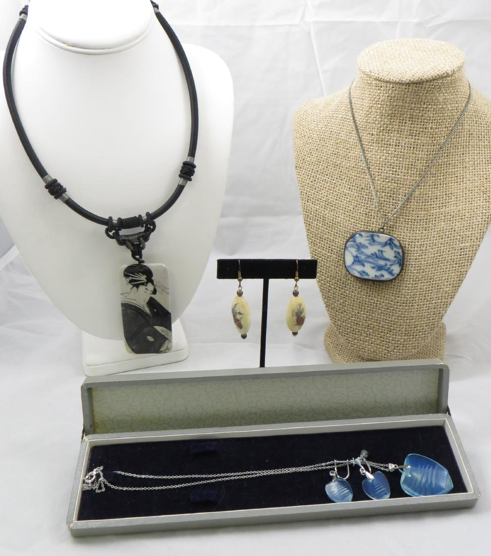 (4) ASIAN COSTUME JEWELRY PIECES: Includes: (1) set of intaglio carved glass pagoda pieces, (1) pair screw-back earrings, (1) necklace with intaglio type pendant, pagoda on blue irridescent glass , in original slide-top box; (1) silk