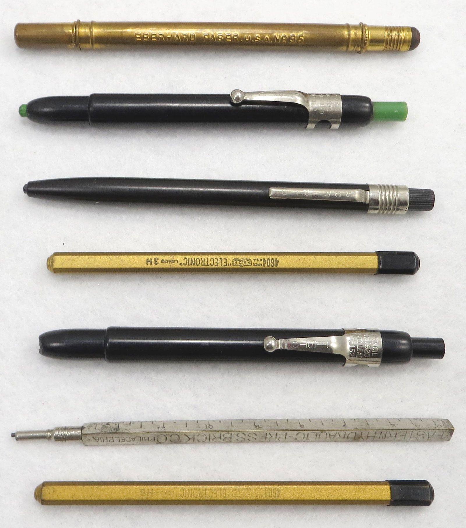 (7) PCS VINTAGE MECHANICAL PENCILS, LEAD & BULLET: Includes: (2) Listo pencils, No. 1620 , lead No. 162; (1) Scripto pencil; (1) advertising "Eastern Hydraulic - PRESSBRICK Co. Phila."; (1) Eberhard Faber USA no. 35 bullet pencil with pen nib; (2) "Ea