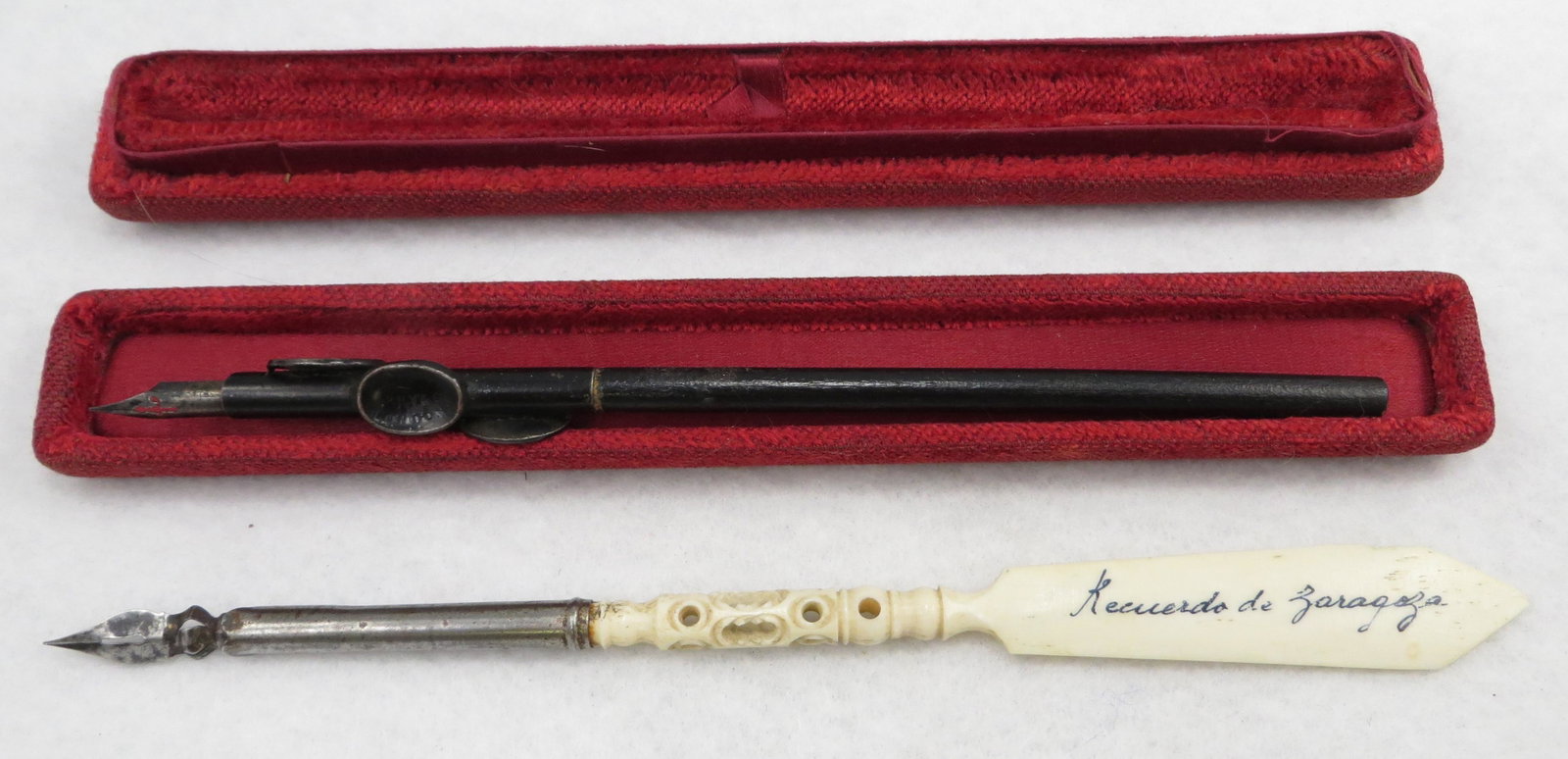 (2) ANTIQUE DIP PENS: (1) carved bone with letter opener from Zaragoza Spain, small edge chip, metal spotty; (1) Perrys & Co. London, patent with wood shaft, 101 nib; original red velvet box, box worn; longest L-8", G-VG