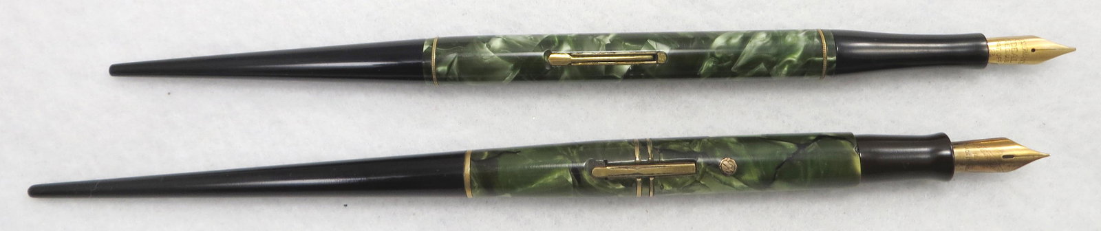 (2) GREEN MARBELIZED DESK PENS: Includes: (1) Waterman, Ideal 2 nib; lever fill; (1) Wahl Eversharp gold-seal (lifetime guarantee) fountain pen, lever fill, 14K FP nib; some minor losses near lever fill; both pens restored; L-8 1/4"