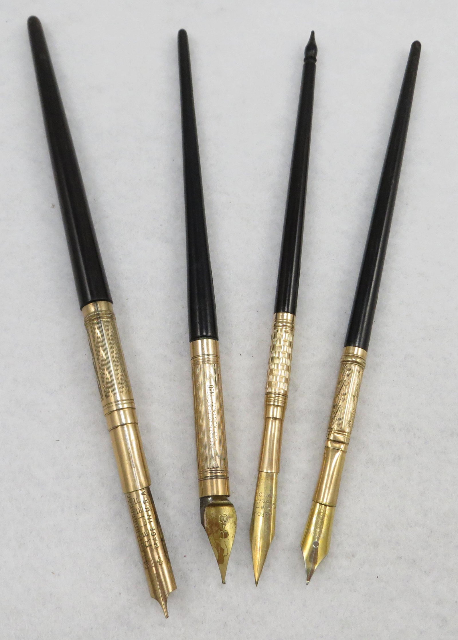 (4) EBONY/WOOD SHAFT DIP PENS: Each with ornately etched ferrule, (1) Mabie Todd, #6 Pat Aug 4 77, with B-6 unusual nib; (1) with Esterbrook Relief 314 nib; (1) brightly etched checkerboard ferrule, Fairchild with Fairchild #4 nib;