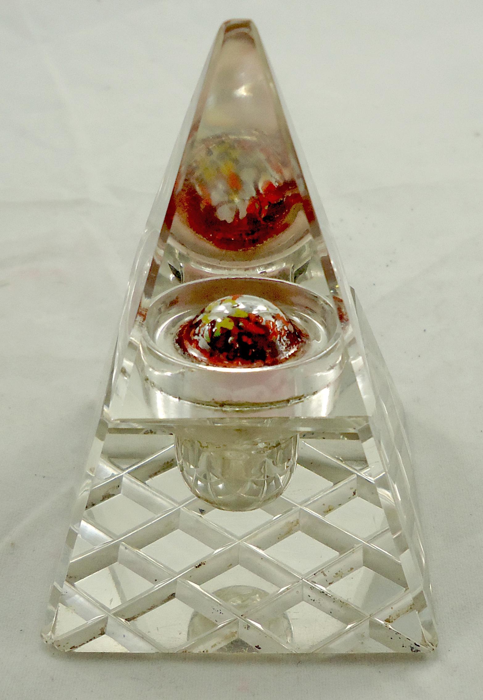 UNUSUAL GLASS PYRAMIDAL INKWELL: Clear glass inkwell with unusual reverse painted convex medallion in lid; hinged brass lid; base with faceted design; some light roughness to front corner, a few tiny flea bites; H-3 1/2", overall G-V